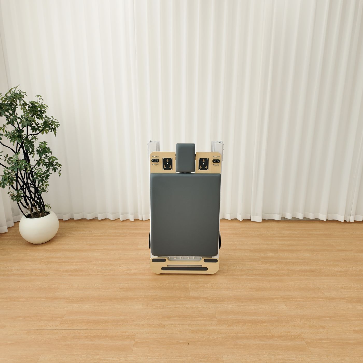 The reformer folded and standing upright, front view.